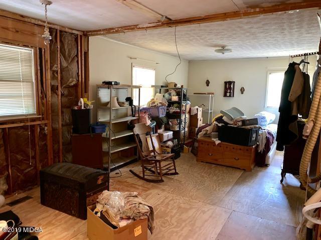 3229 Hamlin Road Lizella, GA 31052 - Photo 11 of 23 a living room with furniture and a flat screen tv