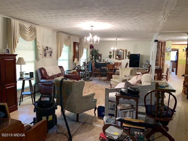 3229 Hamlin Road Lizella, GA 31052 - Photo 5 of 23 a living room with lots of furniture and a view of kitchen