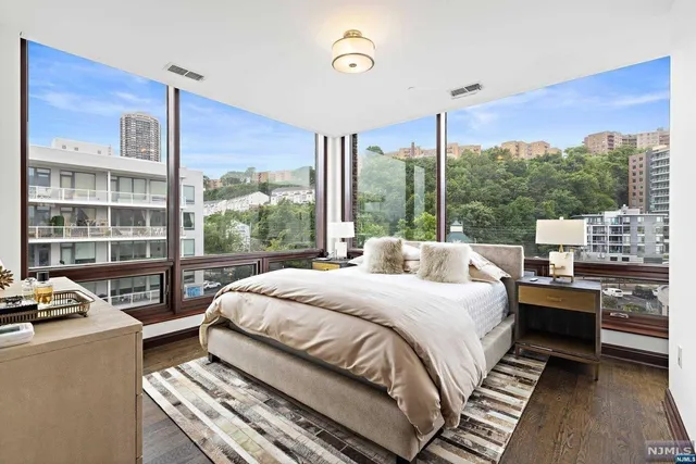 a bed room with a bed and a window