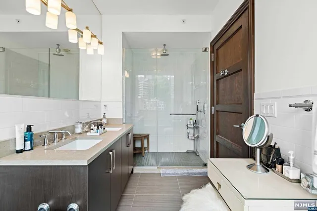 a bathroom with a sink double vanity and a mirror
