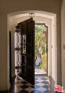 a living room with furniture and a rug