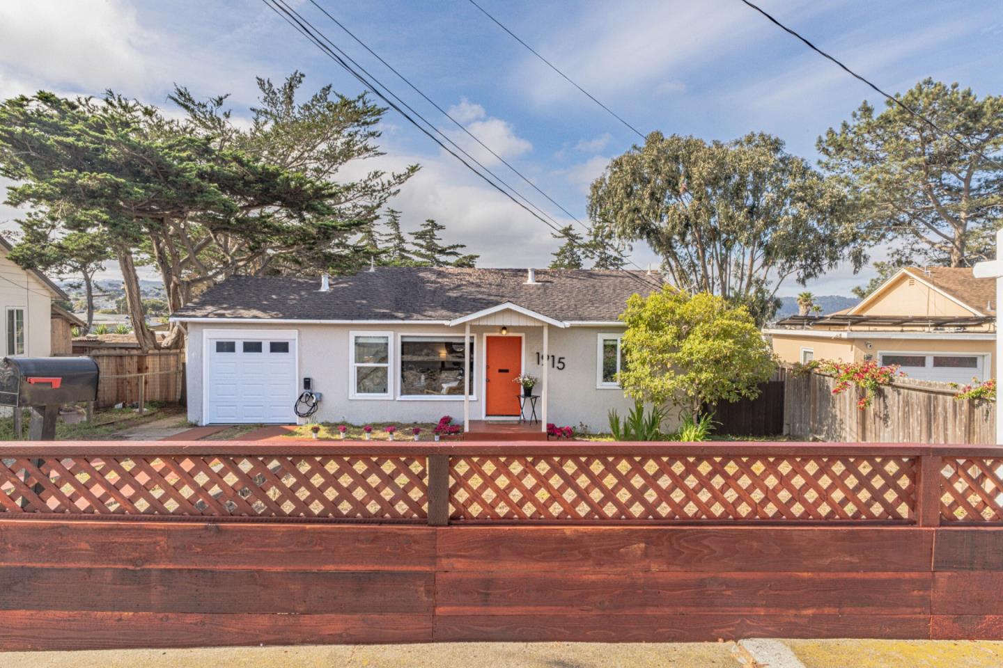 1915 Grandview Street Seaside, CA 93955 - Photo 1 of 29 a front view of a house with a garden