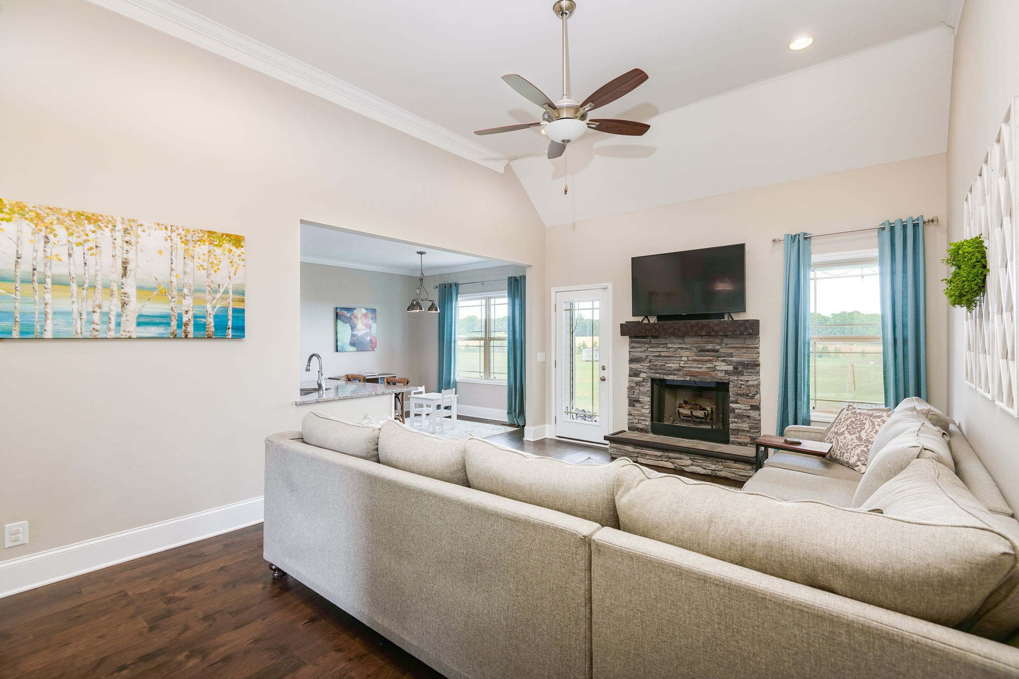 2251 Bluebird Road Lebanon, TN 37087 - Photo 14 of 62 a living room with furniture a fireplace and a flat screen tv