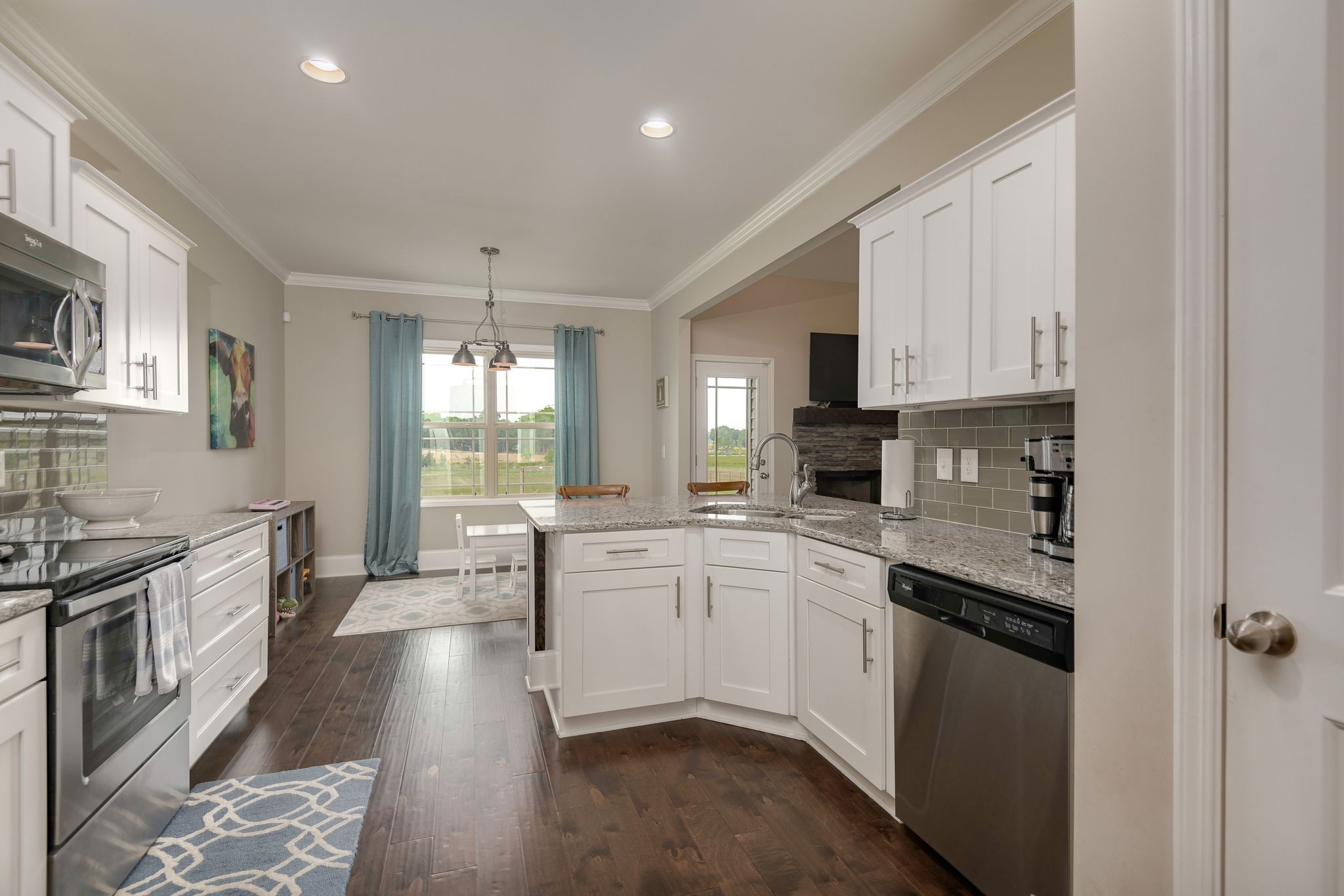 2251 Bluebird Road Lebanon, TN 37087 - Photo 18 of 62 a kitchen with stainless steel appliances granite countertop a stove top oven a sink dishwasher and a refrigerator with wooden floor