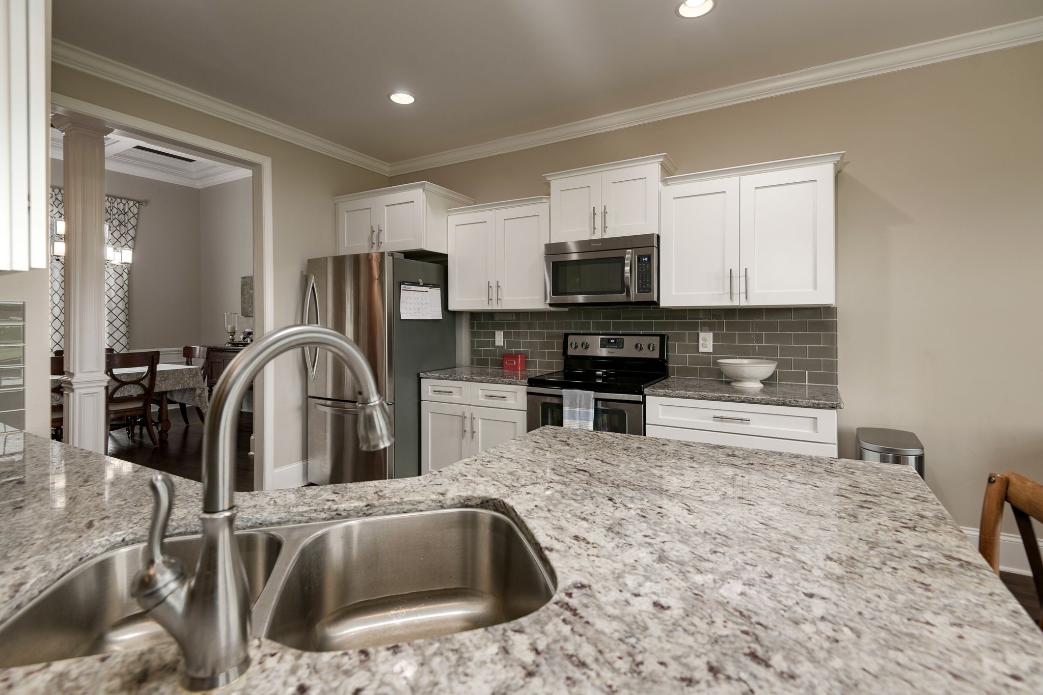 2251 Bluebird Road Lebanon, TN 37087 - Photo 23 of 62 a kitchen with stainless steel appliances granite countertop a sink a stove top oven a counter space and cabinets
