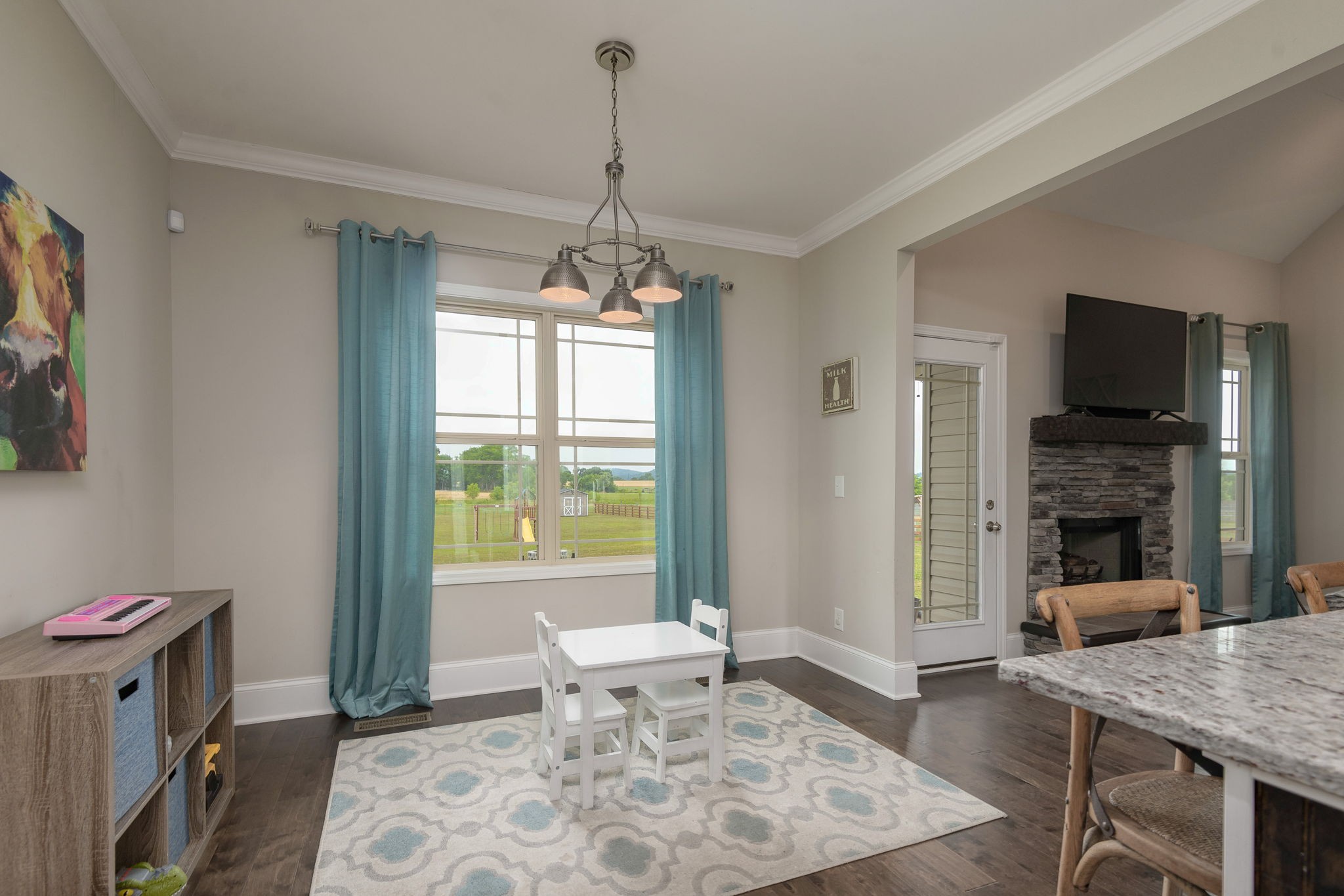 2251 Bluebird Road Lebanon, TN 37087 - Photo 28 of 62 a living room with furniture and a chandelier