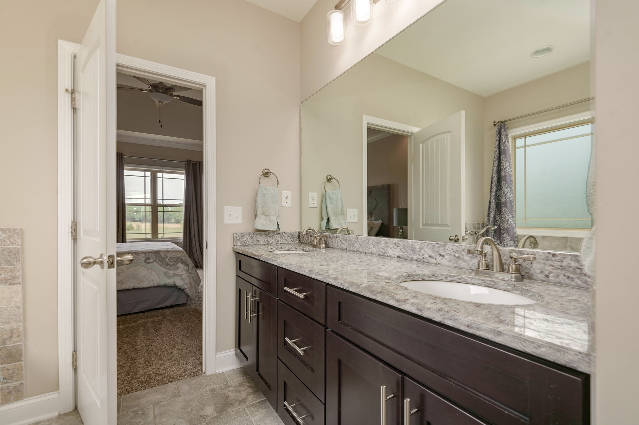 2251 Bluebird Road Lebanon, TN 37087 - Photo 38 of 62 a en suite bathroom with a granite countertop sink and a mirror
