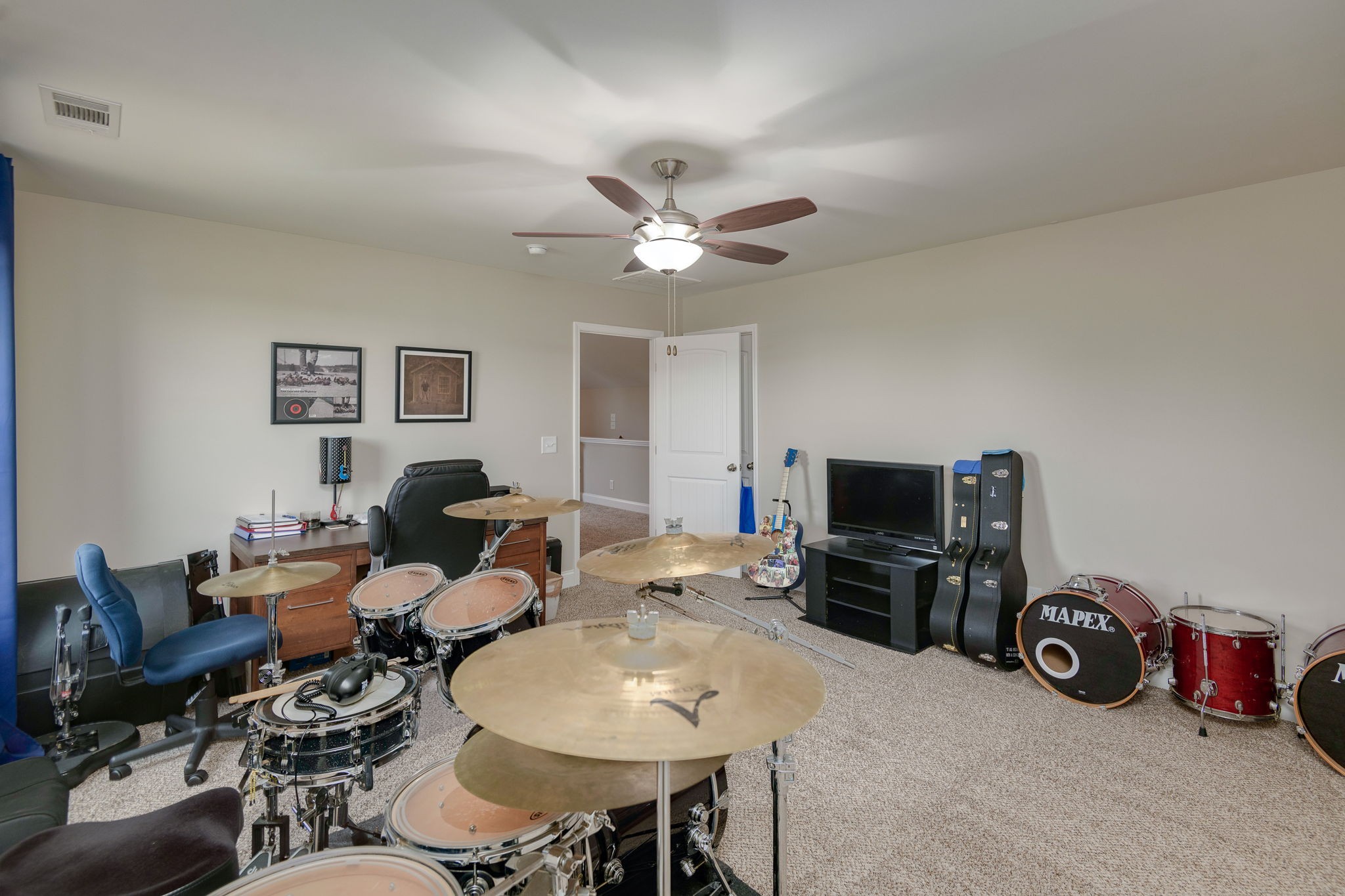 2251 Bluebird Road Lebanon, TN 37087 - Photo 50 of 62 a living room with furniture a flat screen tv and a ceiling fan