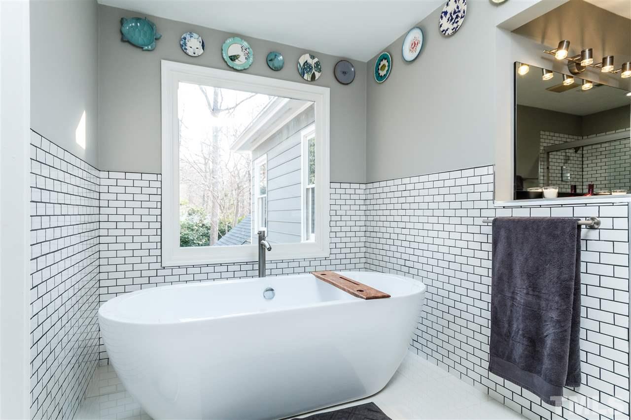 3412 1st Place Raleigh, NC 27613 - Photo 17 of 25 Relax in this amazing stand alone soaking tub!!! Decorative subway tile.