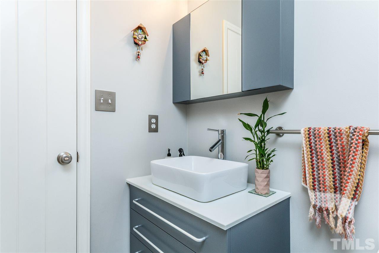 3412 1st Place Raleigh, NC 27613 - Photo 5 of 25 Contemporary style bathroom vanity and cabinets.