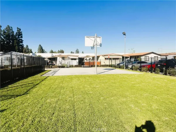a swimming pool with outdoor seating and yard
