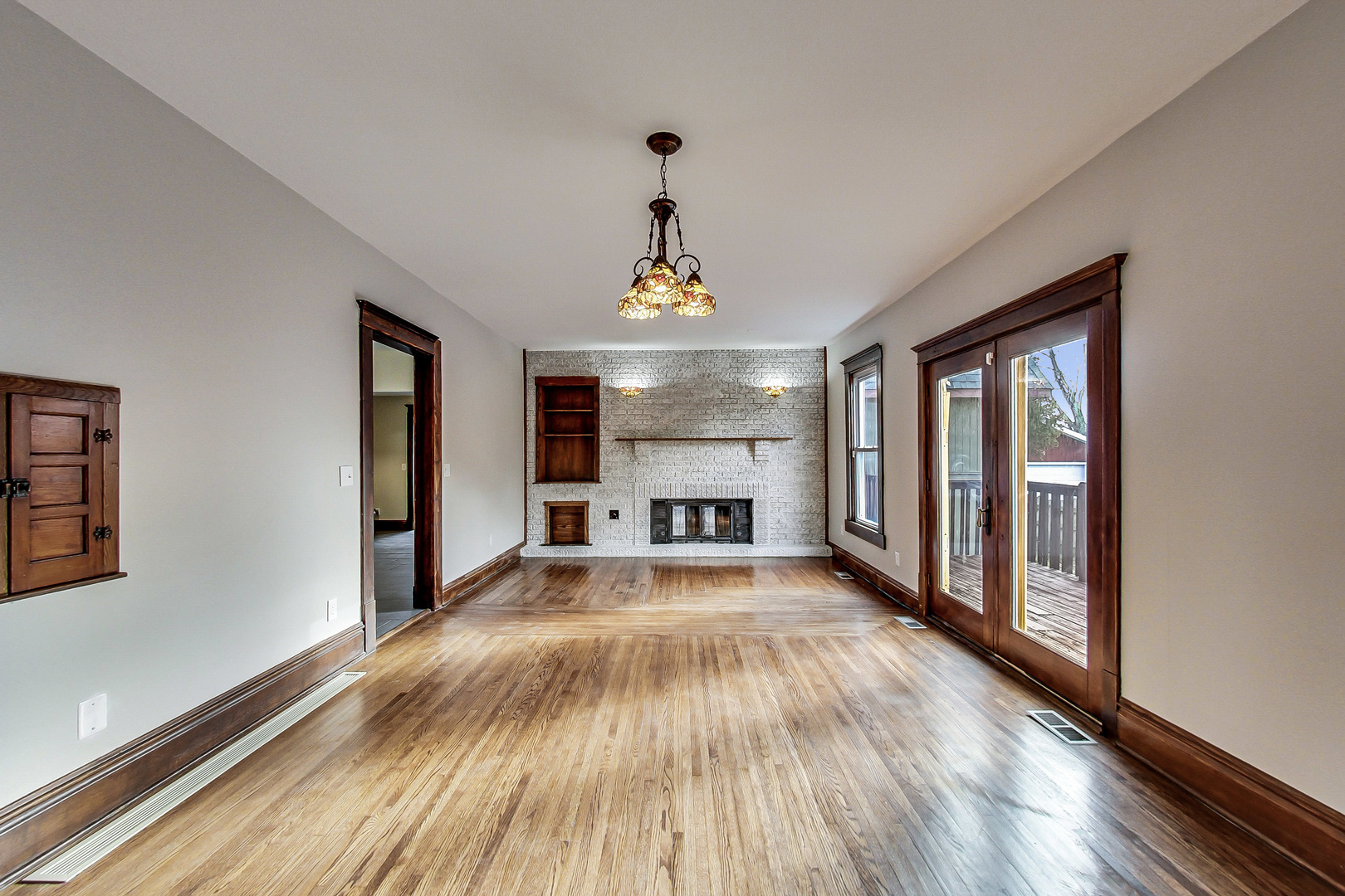 207 Center Road Frankfort, IL 60423 - Photo 14 of 41 a view of big room with wooden floor fireplace and windows