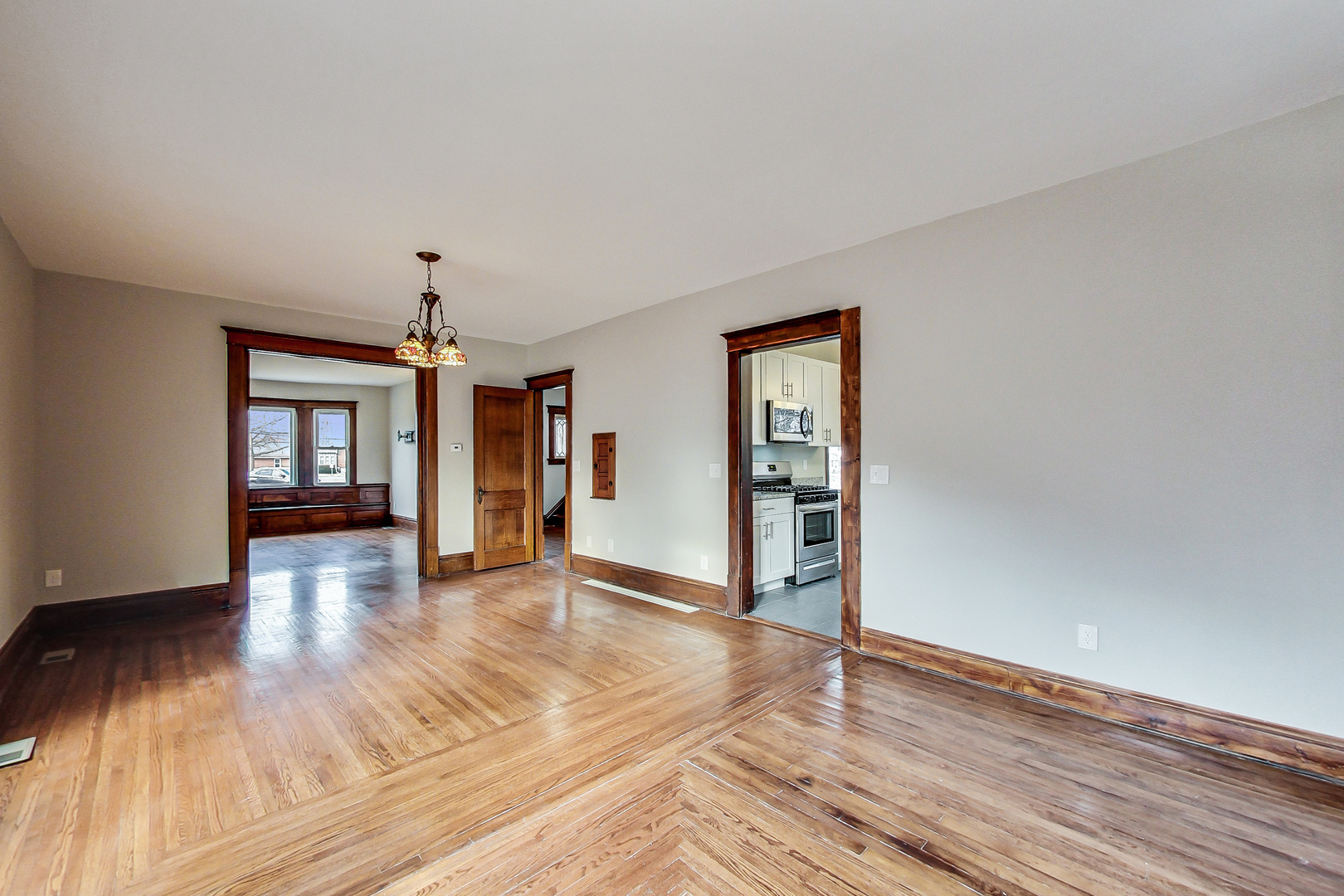 207 Center Road Frankfort, IL 60423 - Photo 15 of 41 a view of an empty room with window and wooden floor
