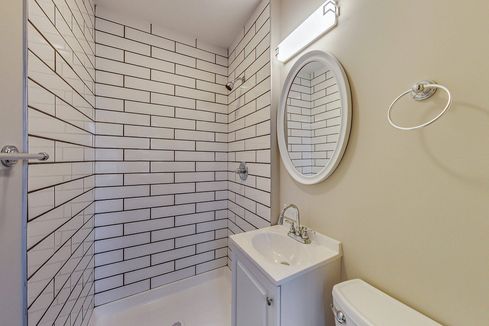 207 Center Road Frankfort, IL 60423 - Photo 17 of 41 a bathroom with a sink a toilet and a mirror