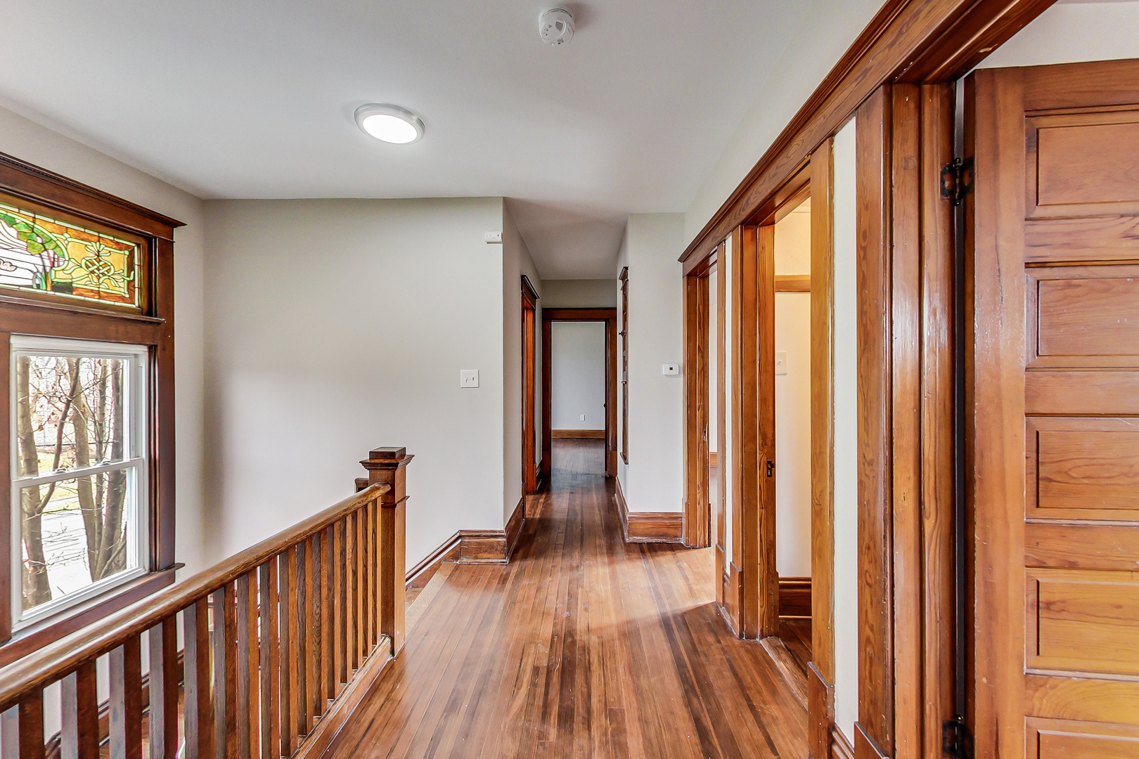 207 Center Road Frankfort, IL 60423 - Photo 18 of 41 a view of hallway with wooden floor and stairs