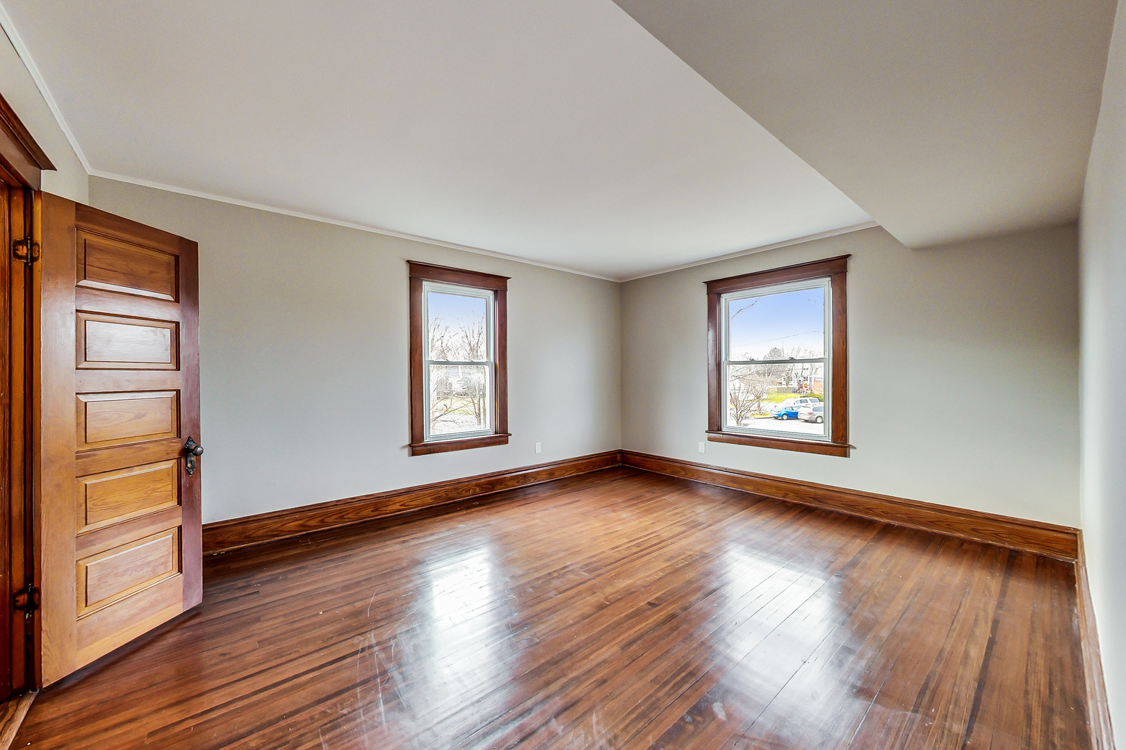207 Center Road Frankfort, IL 60423 - Photo 20 of 41 an empty room with wooden floor and windows