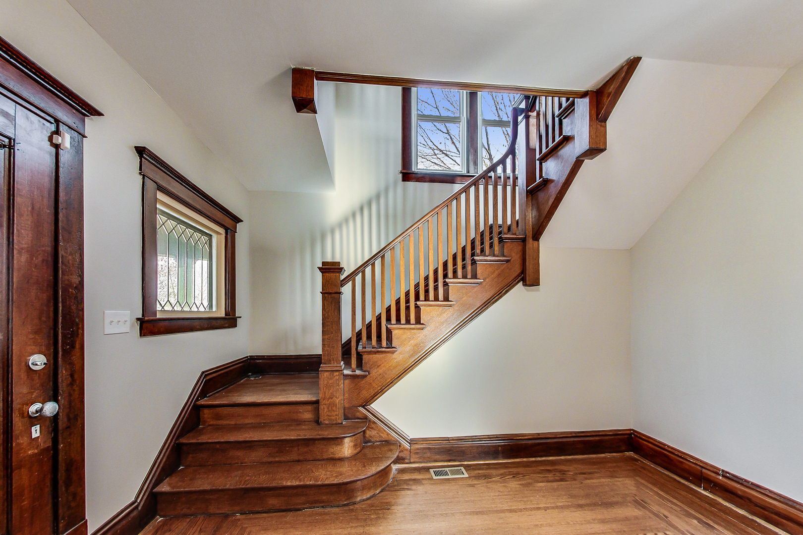 207 Center Road Frankfort, IL 60423 - Photo 5 of 41 a view of entryway and hall with wooden floor