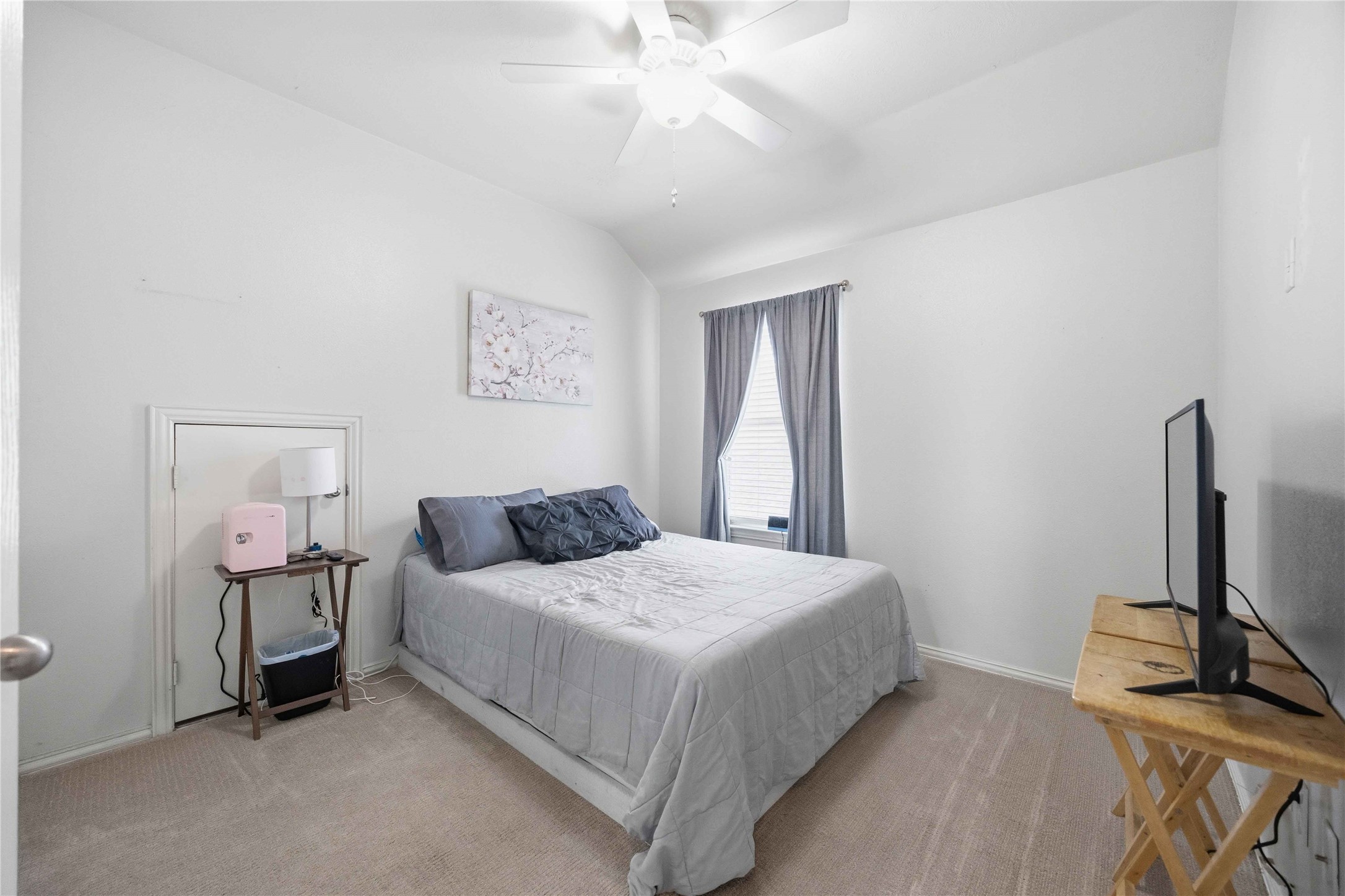 803 Northridge Terrace Lane Spring, TX 77373 - Photo 26 of 42 a bedroom with a bed and a flat tv screen on a dresser