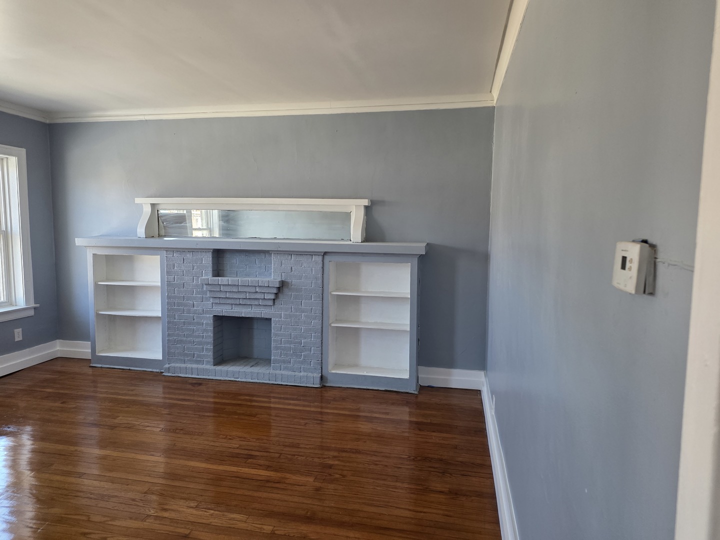 1853 East 79th Street, Unit 2 Chicago, IL 60649 - Photo 2 of 14 a view of kitchen with wooden floor and staircase