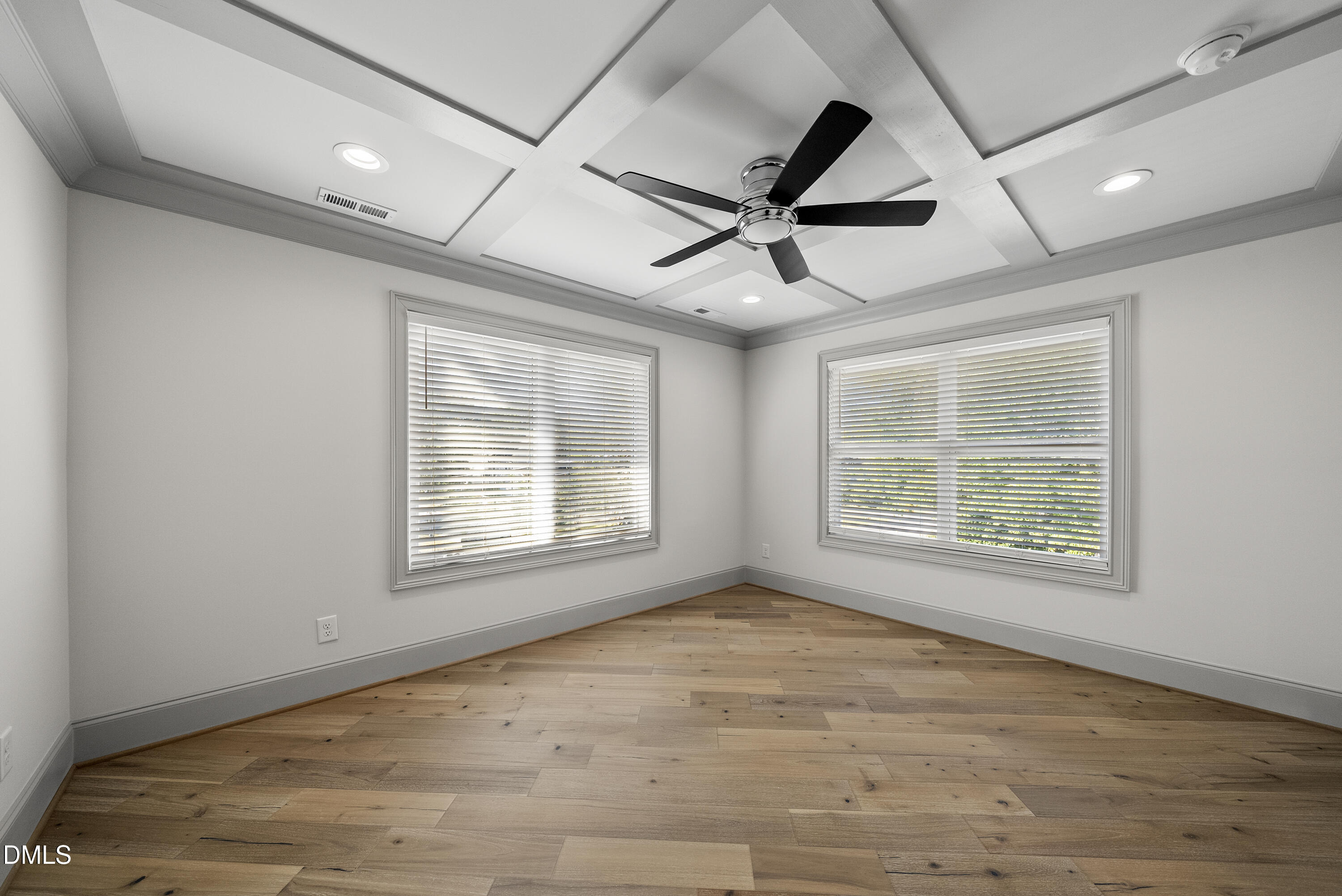 1501 Beauty Avenue Raleigh, NC 27610 - Photo 21 of 30 a view of an empty room with a window and wooden floor