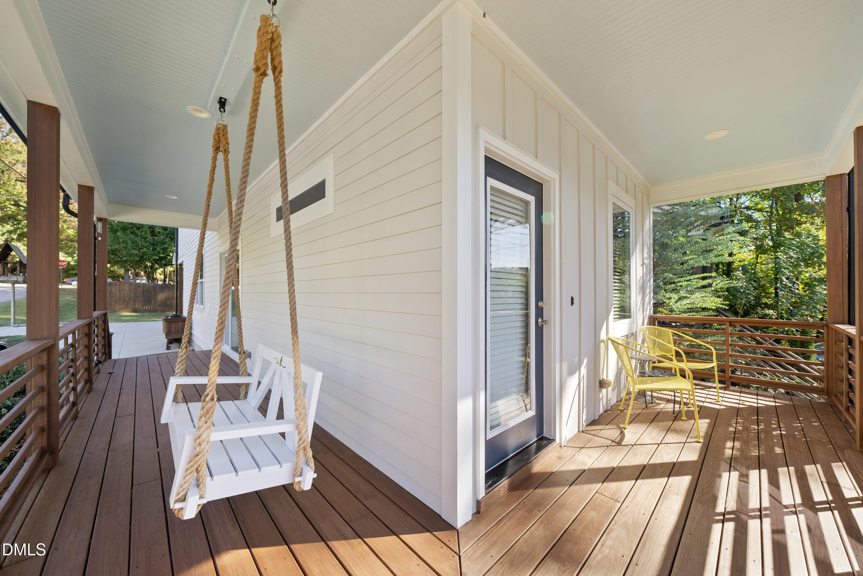 1501 Beauty Avenue Raleigh, NC 27610 - Photo 3 of 30 a balcony with wooden floor table and chairs