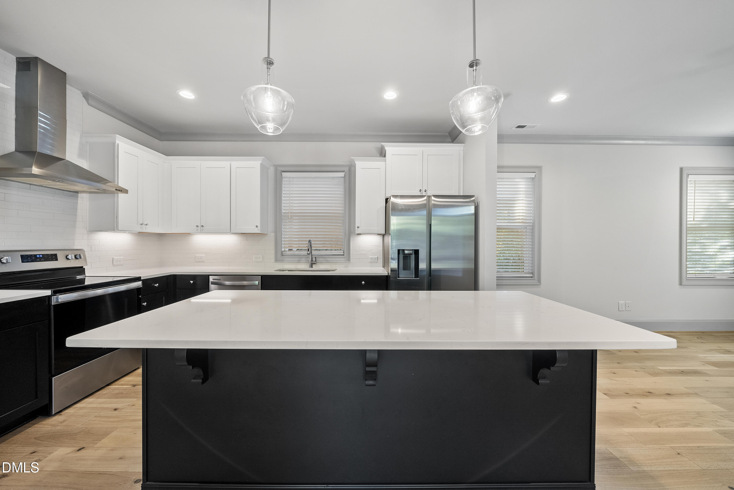 1501 Beauty Avenue Raleigh, NC 27610 - Photo 8 of 30 a kitchen with kitchen island a sink counter space and appliances