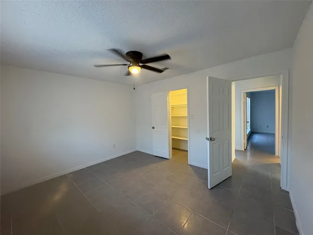 an empty room with a bathroom