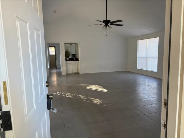 a view of a room with a hallway