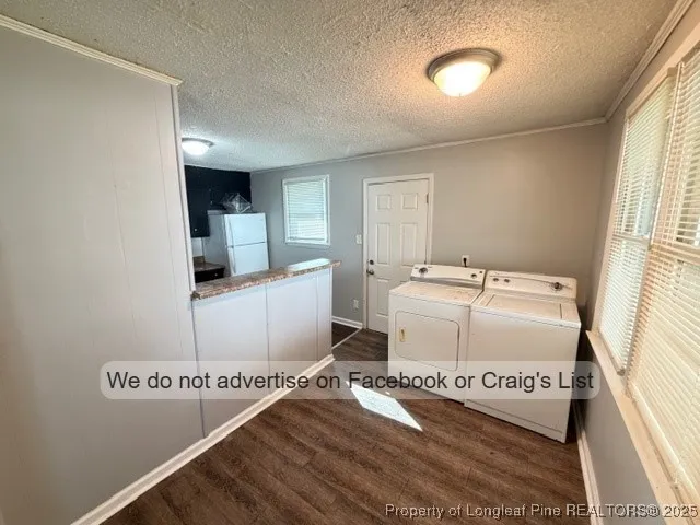 a view of a room with furniture and windows
