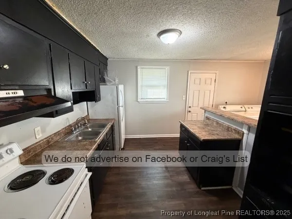a kitchen with a stove and a sink
