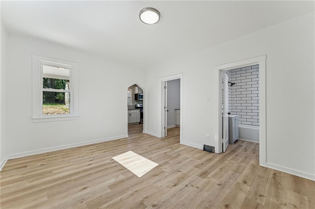 117 Owen Street McKees Rocks, PA 15136 - Photo 11 of 35 an empty room with wooden floor and windows