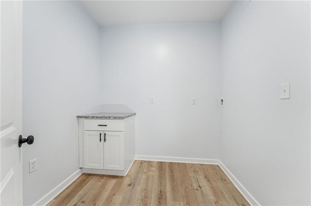 117 Owen Street McKees Rocks, PA 15136 - Photo 18 of 35 a view of a room with wooden floor and white walls