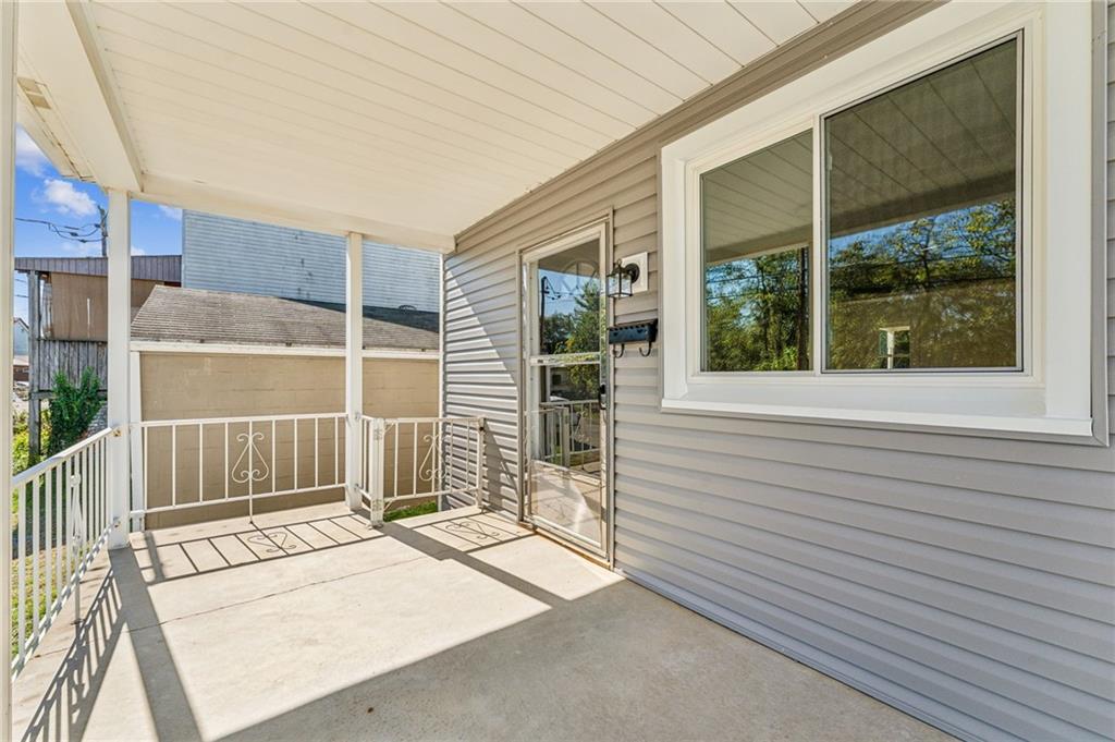 117 Owen Street McKees Rocks, PA 15136 - Photo 5 of 35 a view of a house with a large window