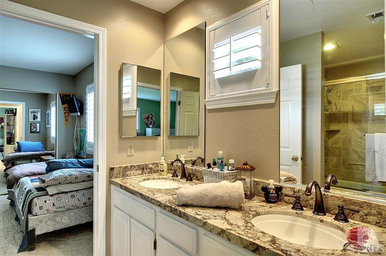 10612 Chippenham Road Camarillo, CA 93012 - Photo 16 of 16 a en suite bathroom with double vanity and a mirror