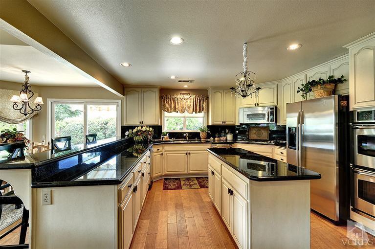 10612 Chippenham Road Camarillo, CA 93012 - Photo 4 of 16 a kitchen with stainless steel appliances granite countertop a sink a stove and refrigerator