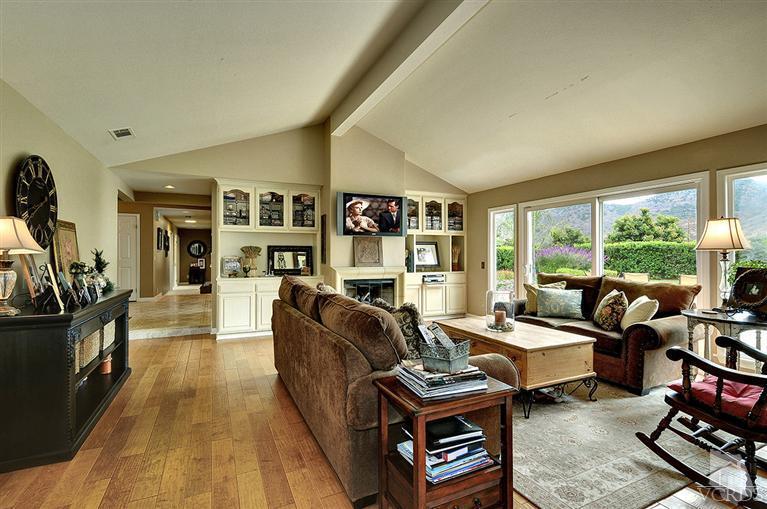 10612 Chippenham Road Camarillo, CA 93012 - Photo 6 of 16 a living room with furniture fireplace and a large window