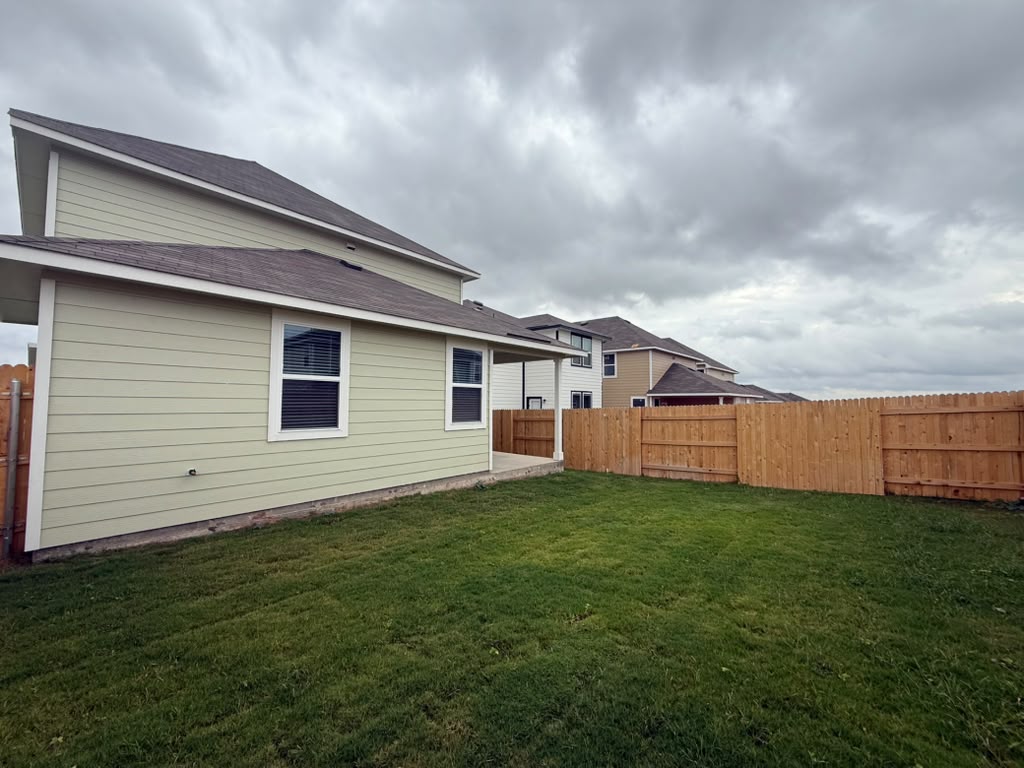 2601 Foss Road Manor, TX 78653 - Photo 26 of 40 Green grass fills a spacious, fully fenced backyard.