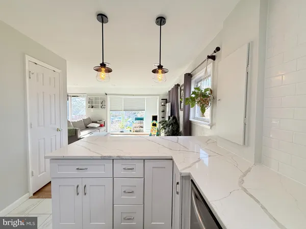 a view of a kitchen and sink