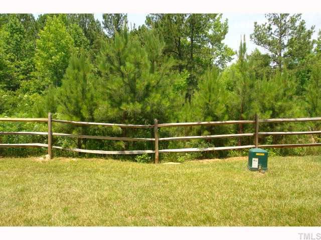 5326 Echo Ridge Road Raleigh, NC 27612 - Photo 12 of 12 a view of a yard with wooden fence