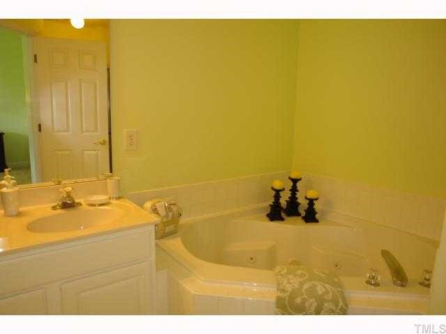 5326 Echo Ridge Road Raleigh, NC 27612 - Photo 8 of 12 a bathroom with a sink tub and shower