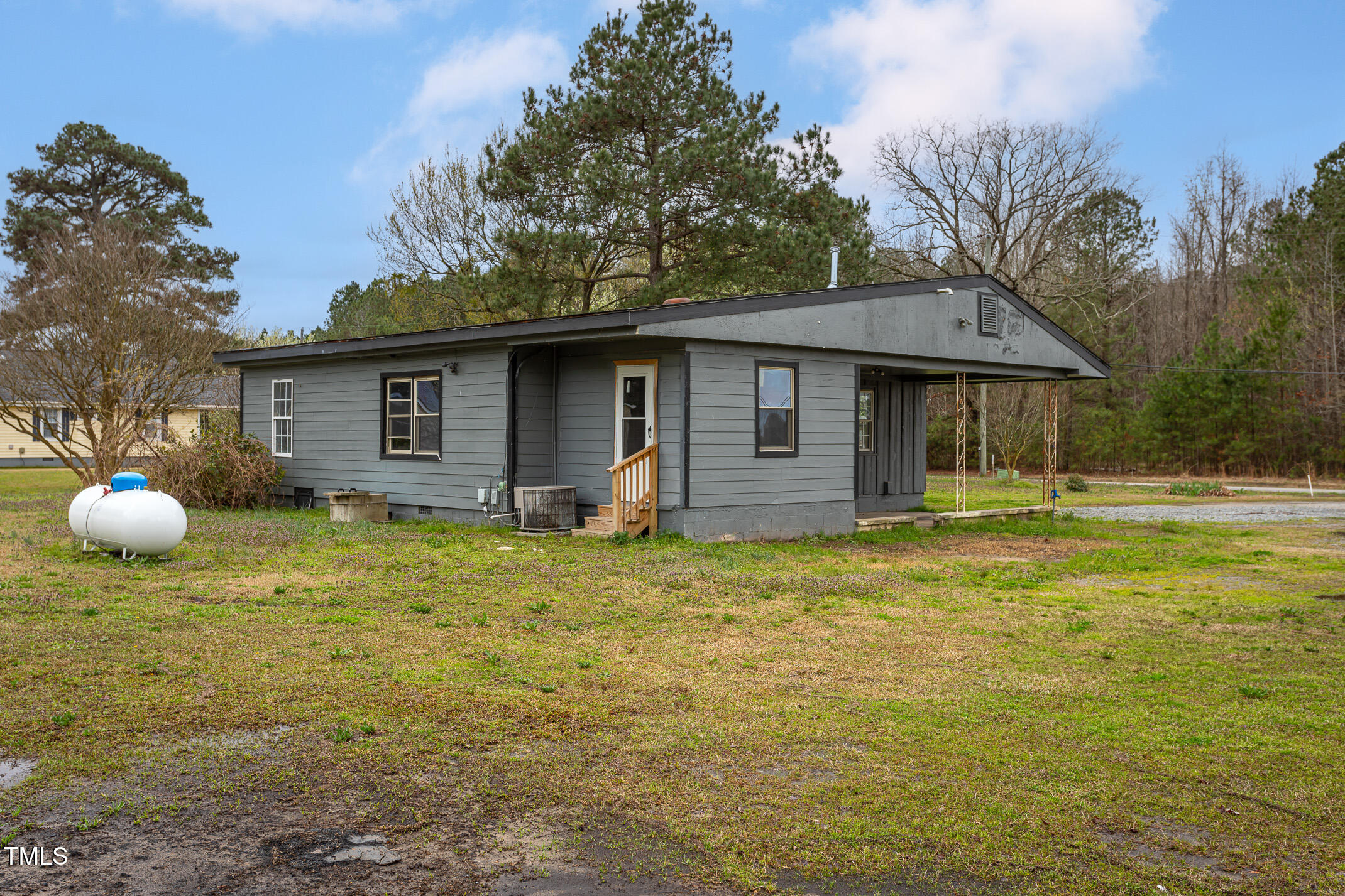 1239 Brogden Road Smithfield, NC 27577 - Photo 13 of 14 a backyard of a house with table and chairs
