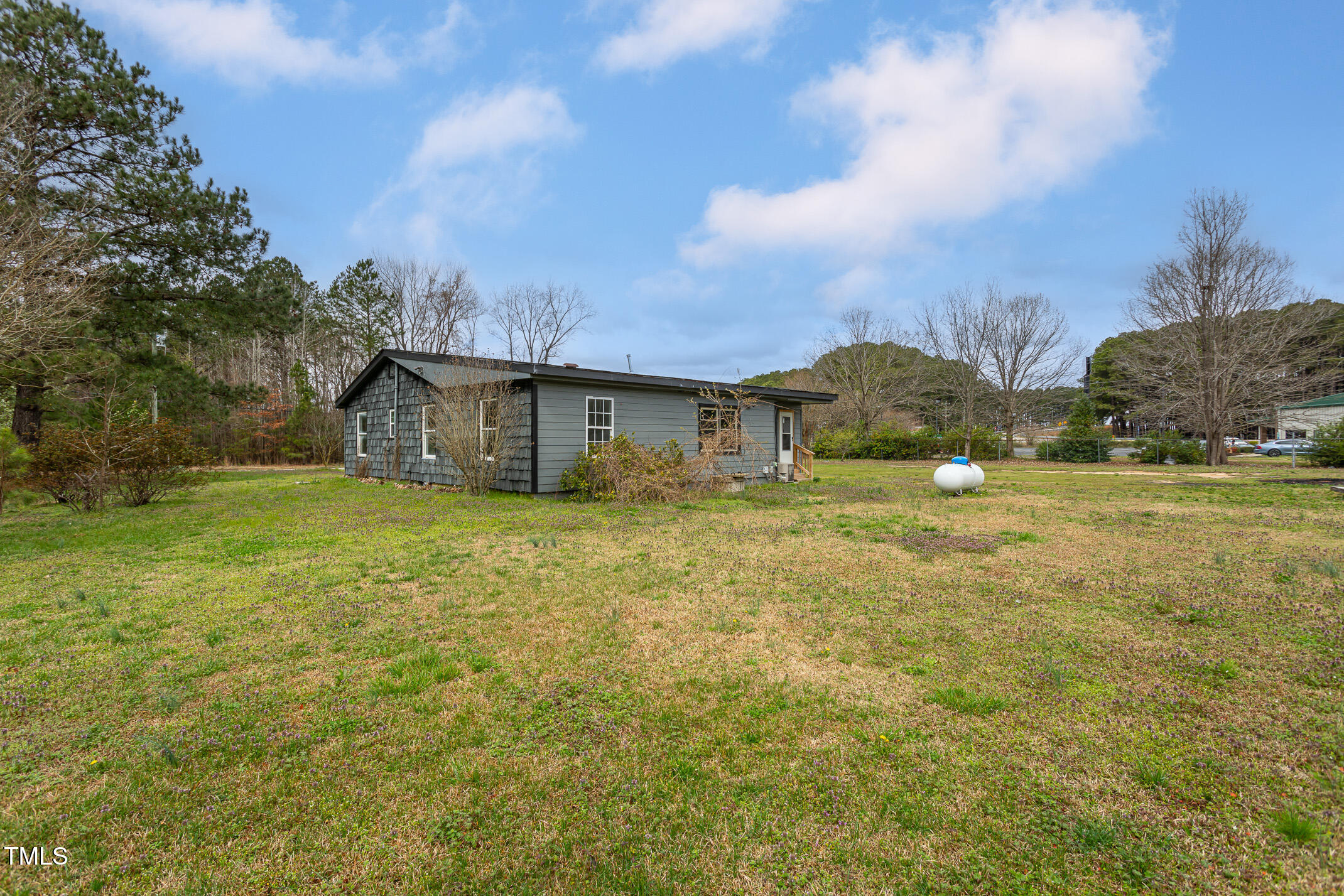 1239 Brogden Road Smithfield, NC 27577 - Photo 14 of 14 a front view of house with yard and trees around