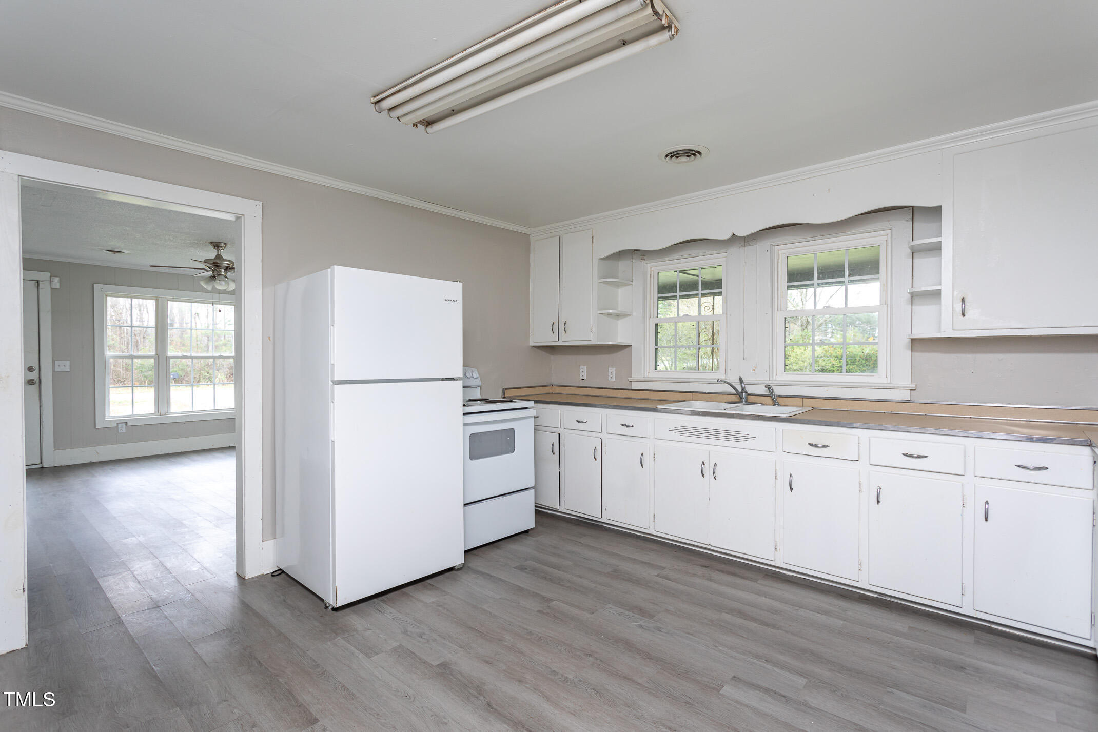 1239 Brogden Road Smithfield, NC 27577 - Photo 4 of 14 a kitchen with granite countertop white cabinets and white appliances