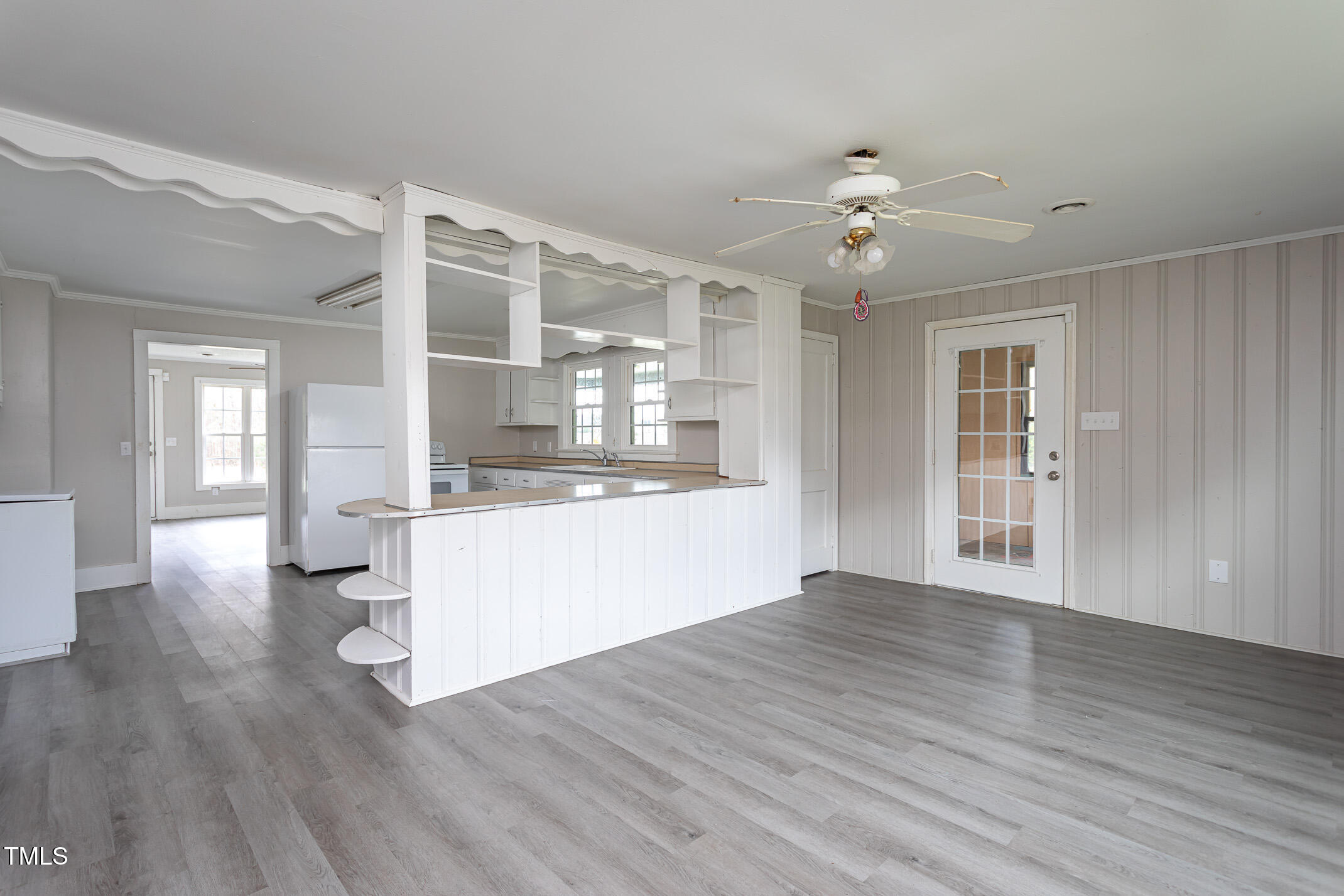 1239 Brogden Road Smithfield, NC 27577 - Photo 7 of 14 a view of an empty room with kitchen and a window