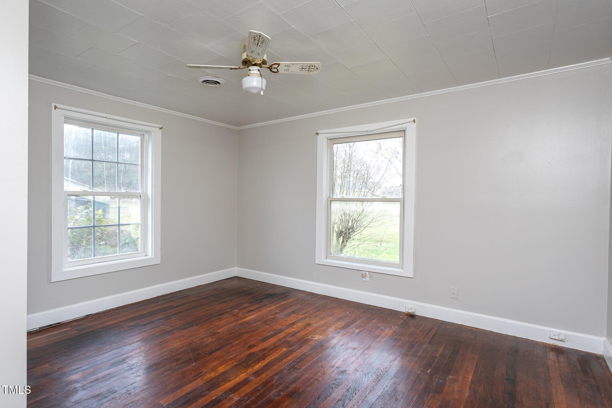 1239 Brogden Road Smithfield, NC 27577 - Photo 10 of 14 a view of an empty room with a window and wooden floor