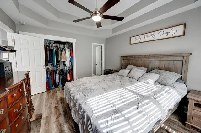 a bedroom with a bed and a dresser