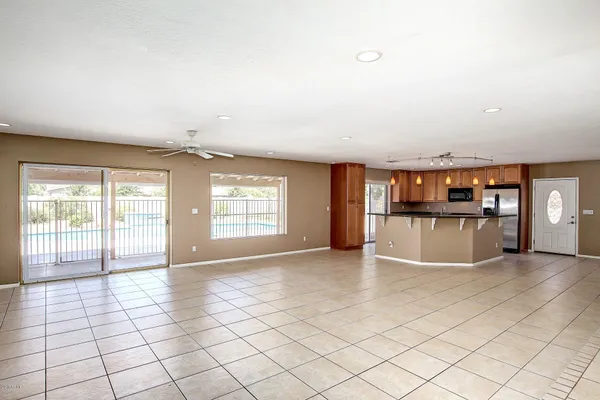 an empty room with windows and view