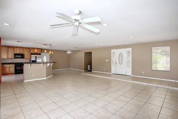 a view of a kitchen with microwave and cabinets