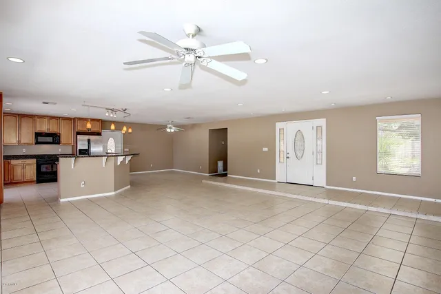 a view of a kitchen with microwave and cabinets