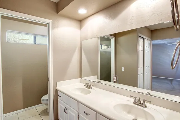 a bathroom with a shower and a mirror